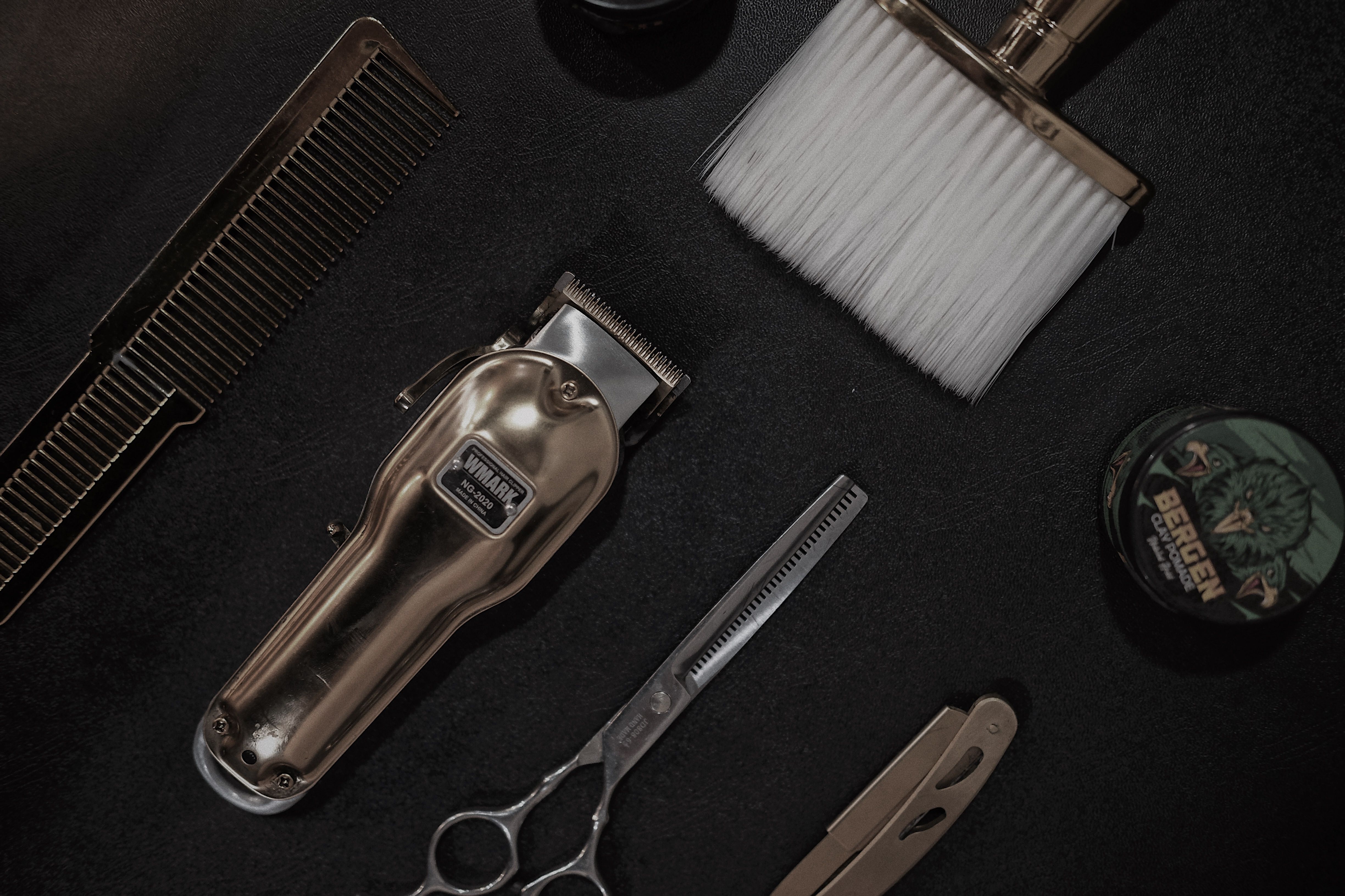 Premium barber service detail with clippers and grooming tools