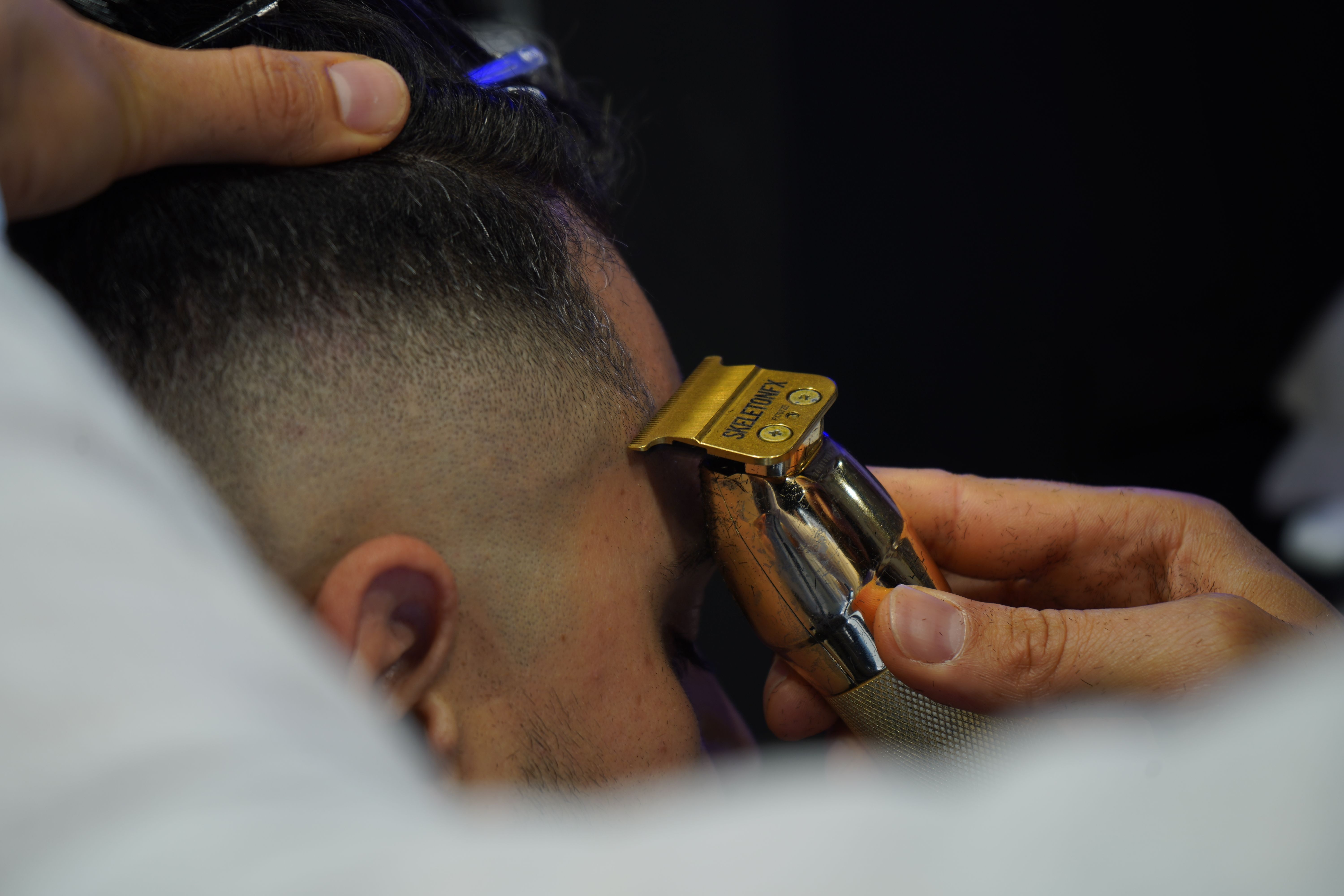 Close haircut detail with professional clippers